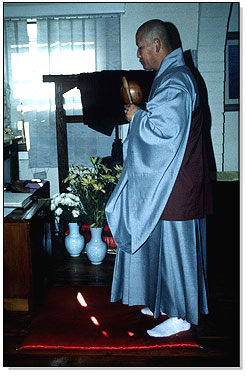 Monk conducting a service.